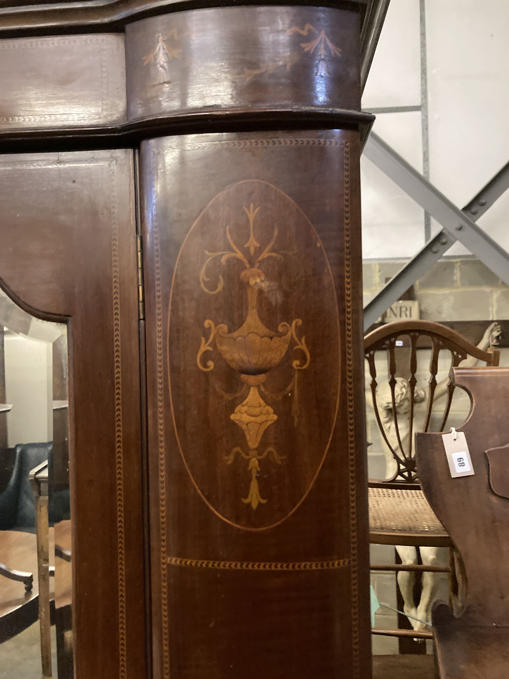 A Victorian inlaid mahogany mirrored wardrobe of two doors, length 146cm, depth 48cm, height 206cm